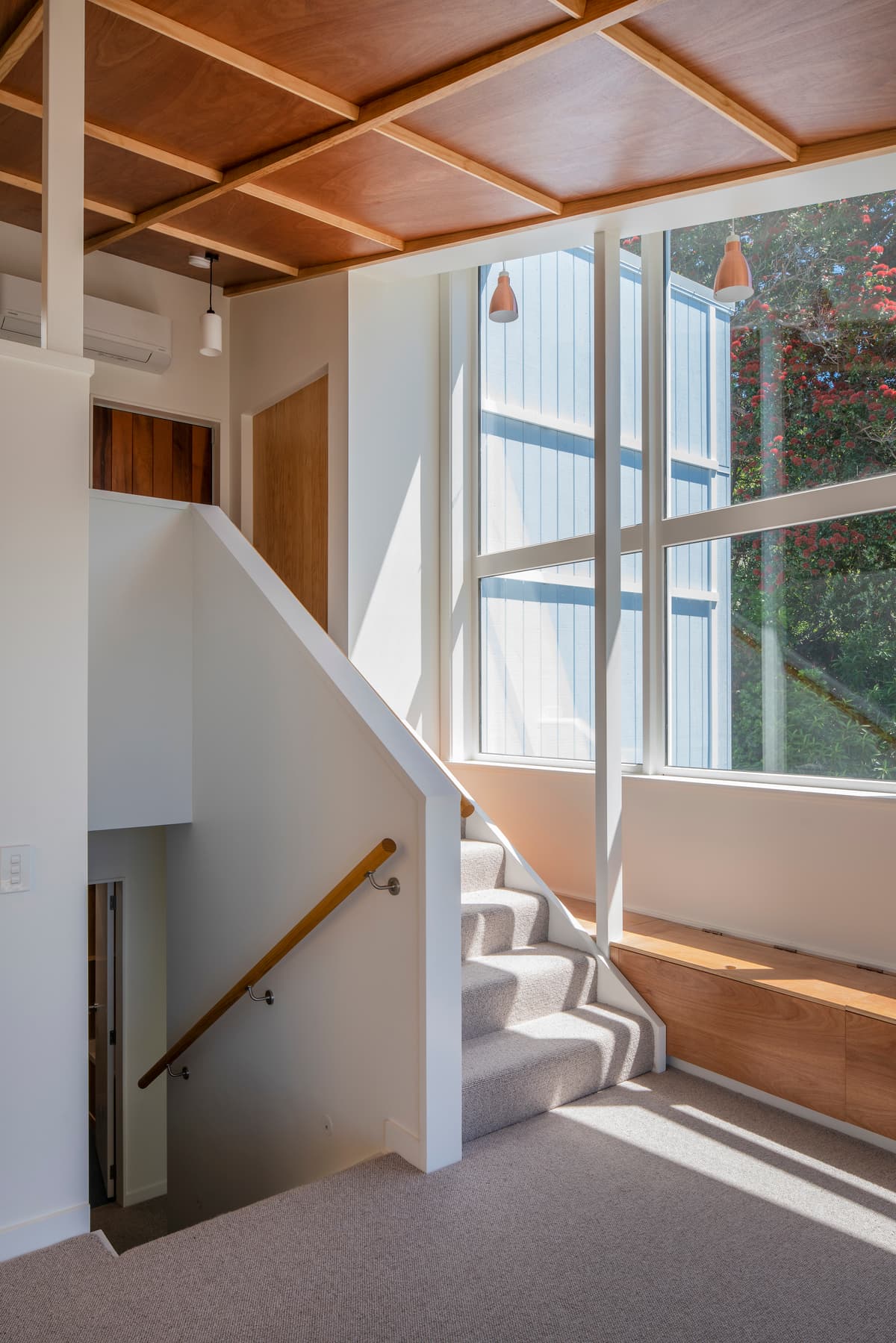 Half-flights of stairs connect the house's different levels.