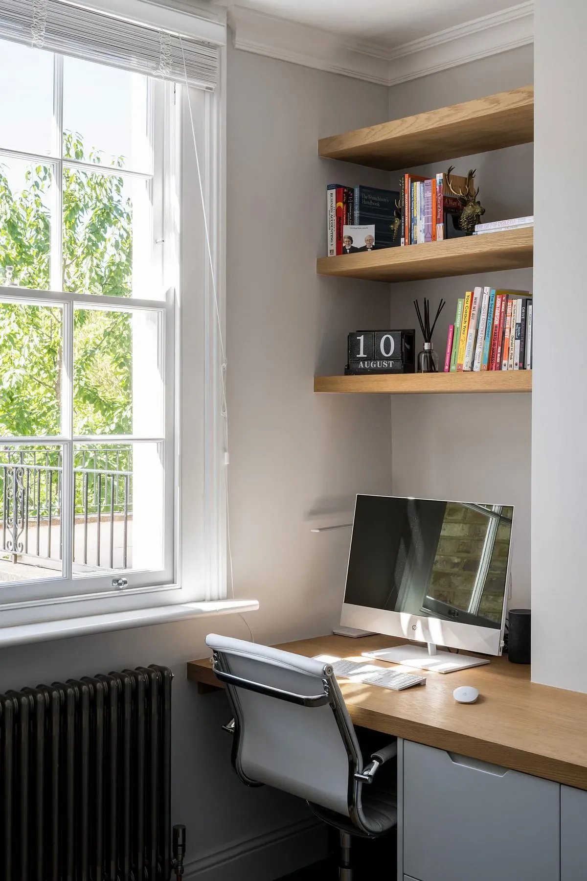 A garden-facing room is fitted out as a study.
