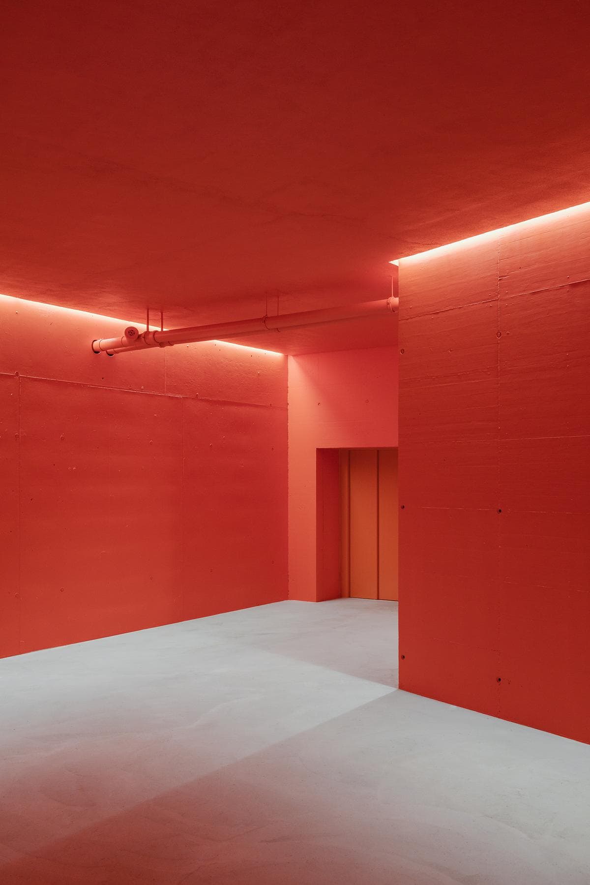 A red-painted space at the lower level