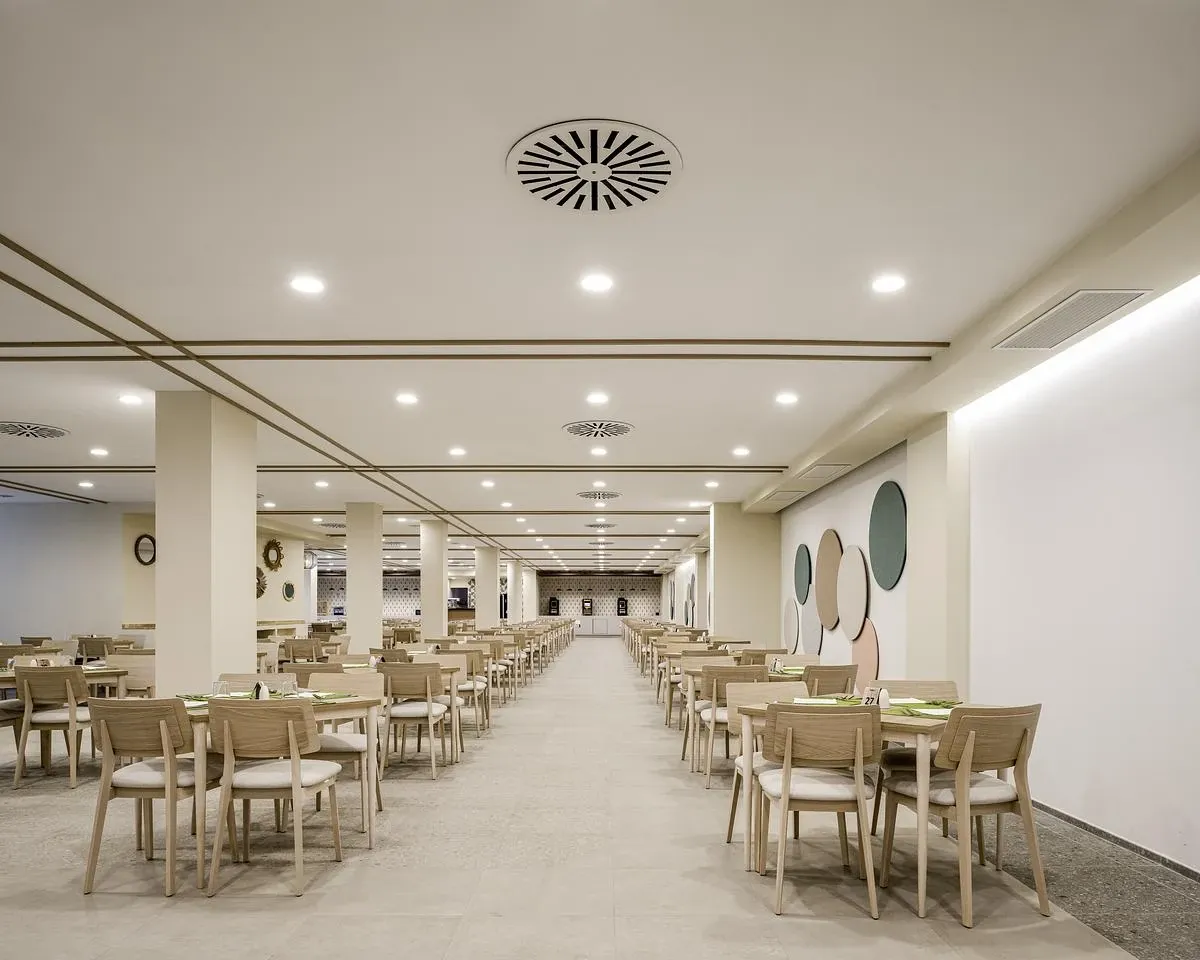 Rows of timber dining chairs fill the main dining room.