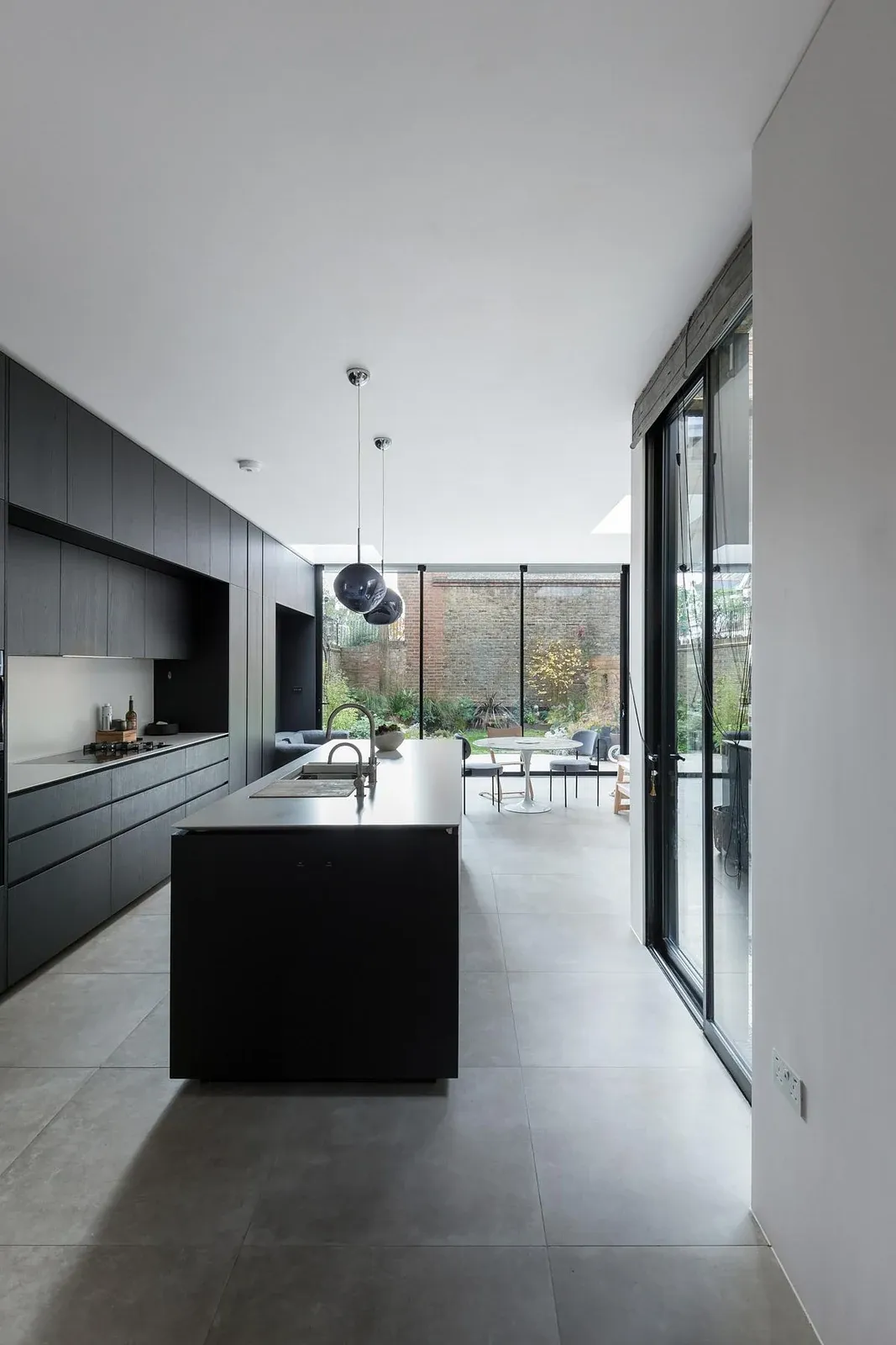 Kitchen island facing the glazed courtyard doors.