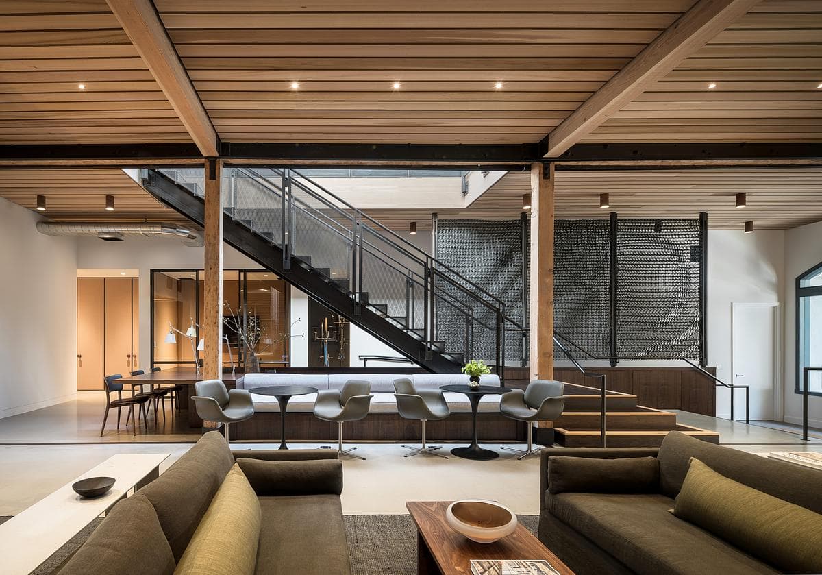 Shared ground-floor spaces beneath the exposed timber structure.
