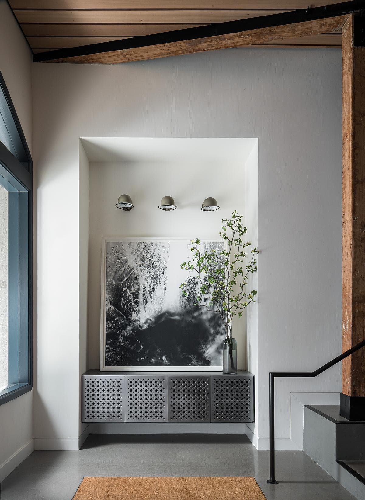 New interior finishes beneath an exposed timber beam.