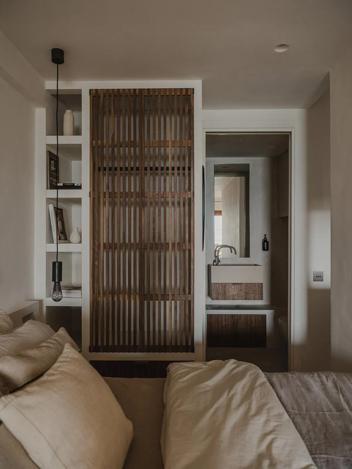 The bedroom and living areas share a continuous view through the apartment.