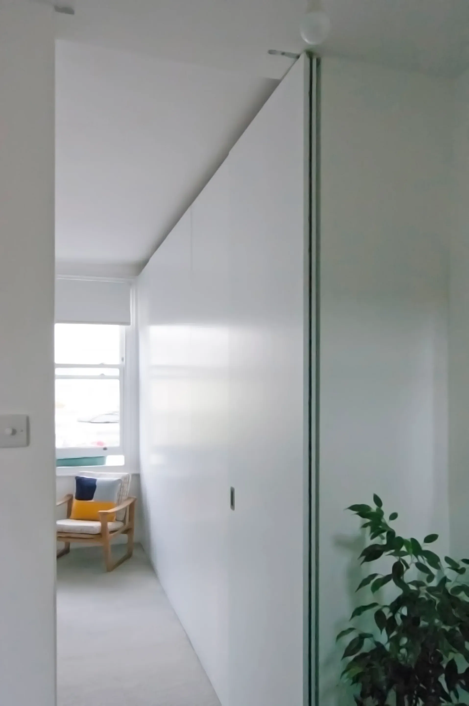A full-height opening preserves the view through to the front rooms.