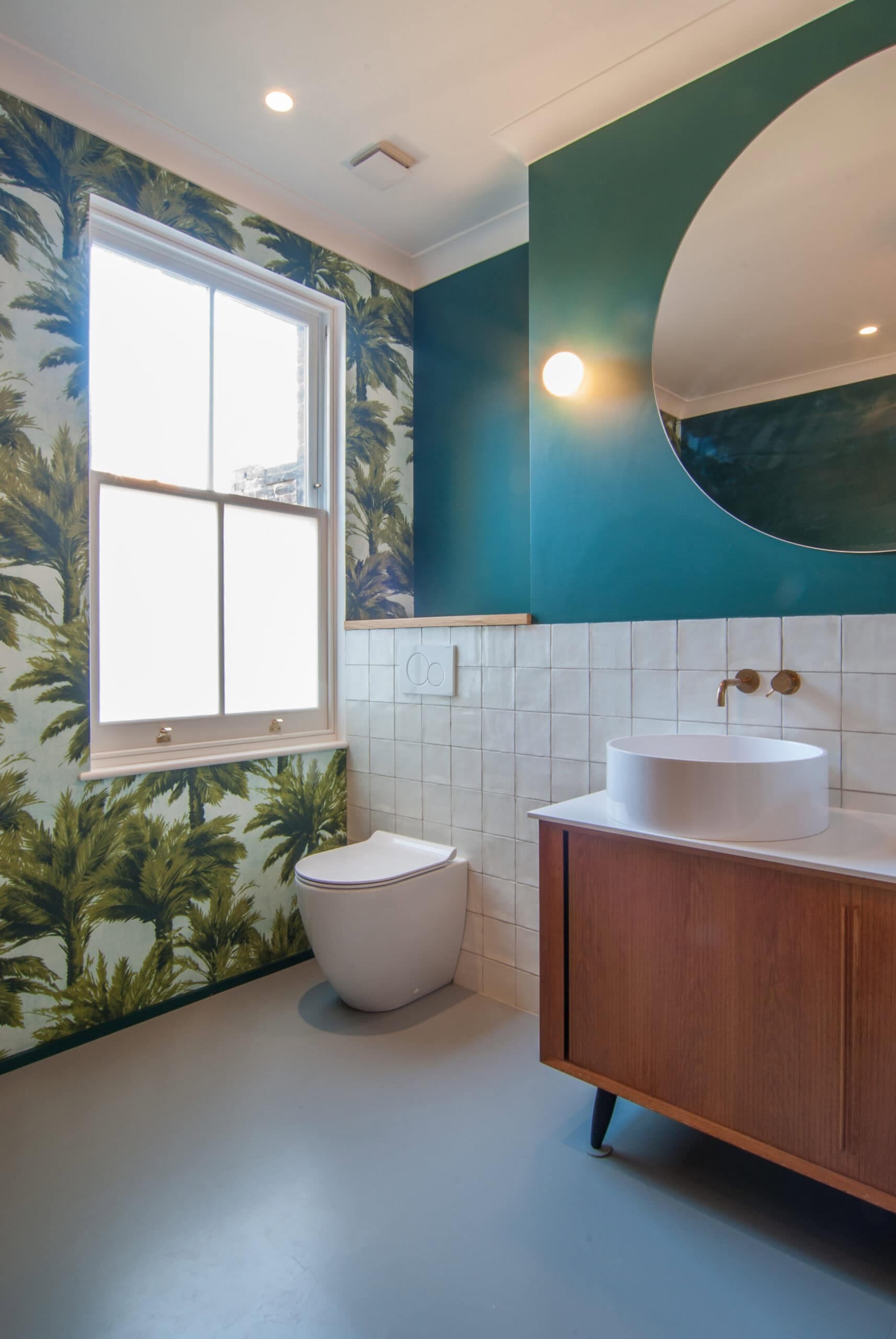 Bathroom with patterned wallpaper.