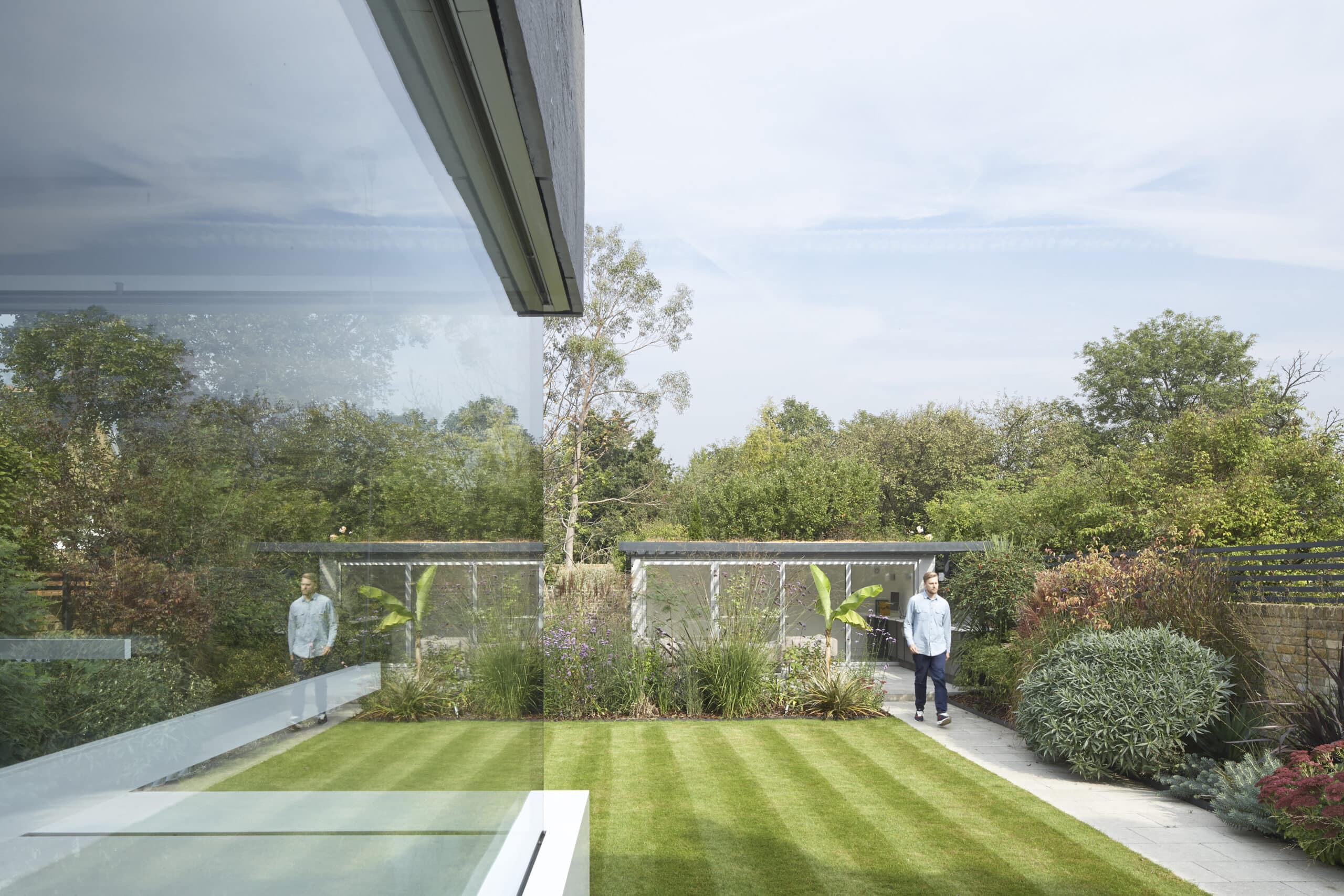 Garden reflected in the glazing.