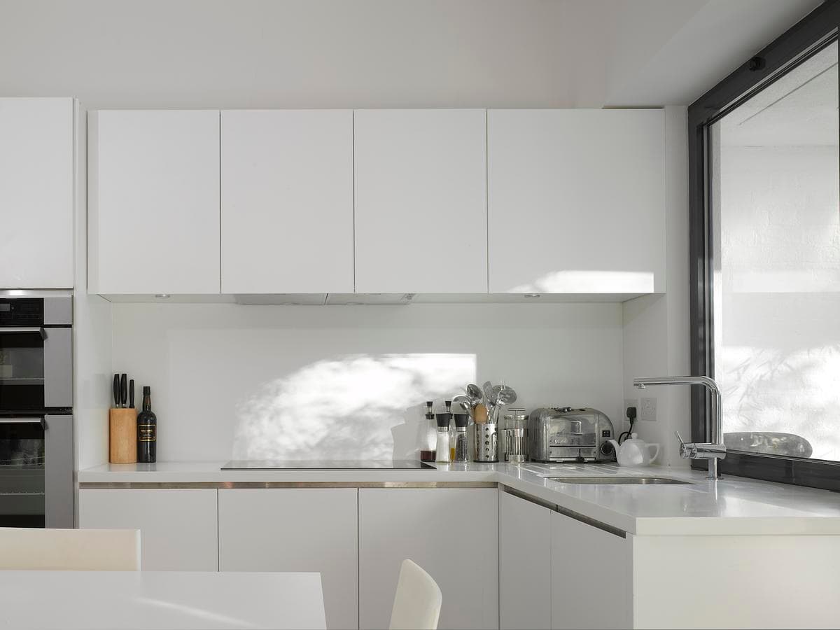 White kitchen with a central island.
