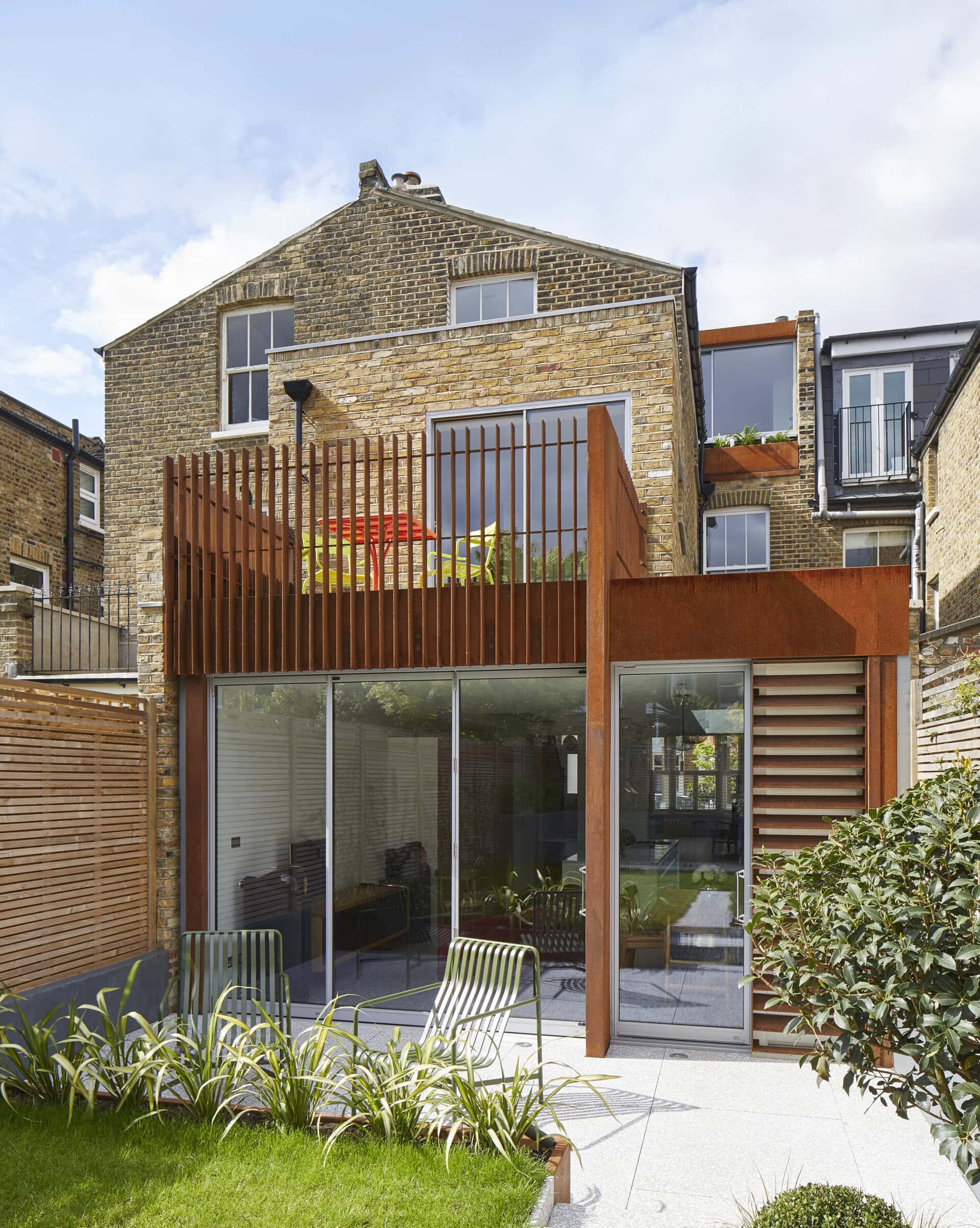 Rear facade with weathered steel cladding.