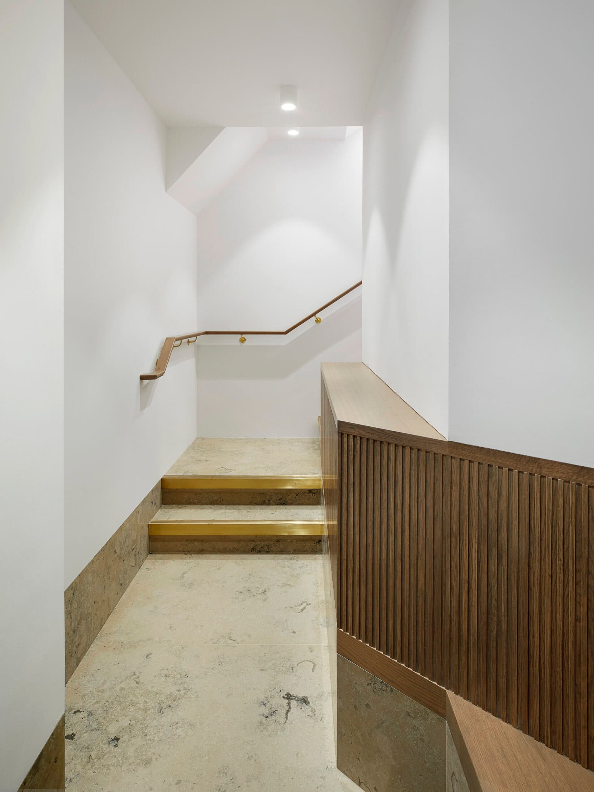 White stair and timber finishes.