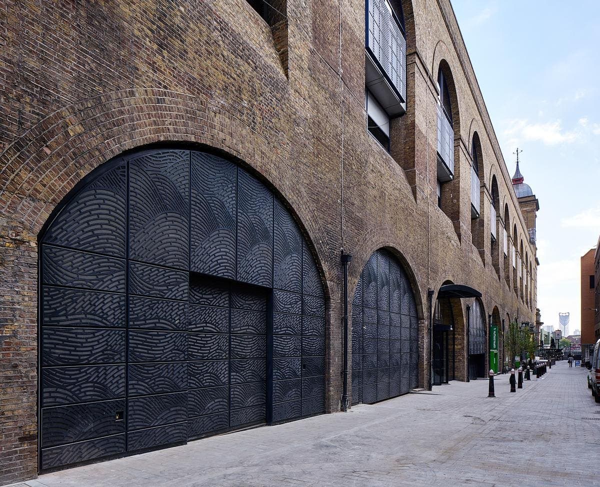 Brick street facade with tall windows.
