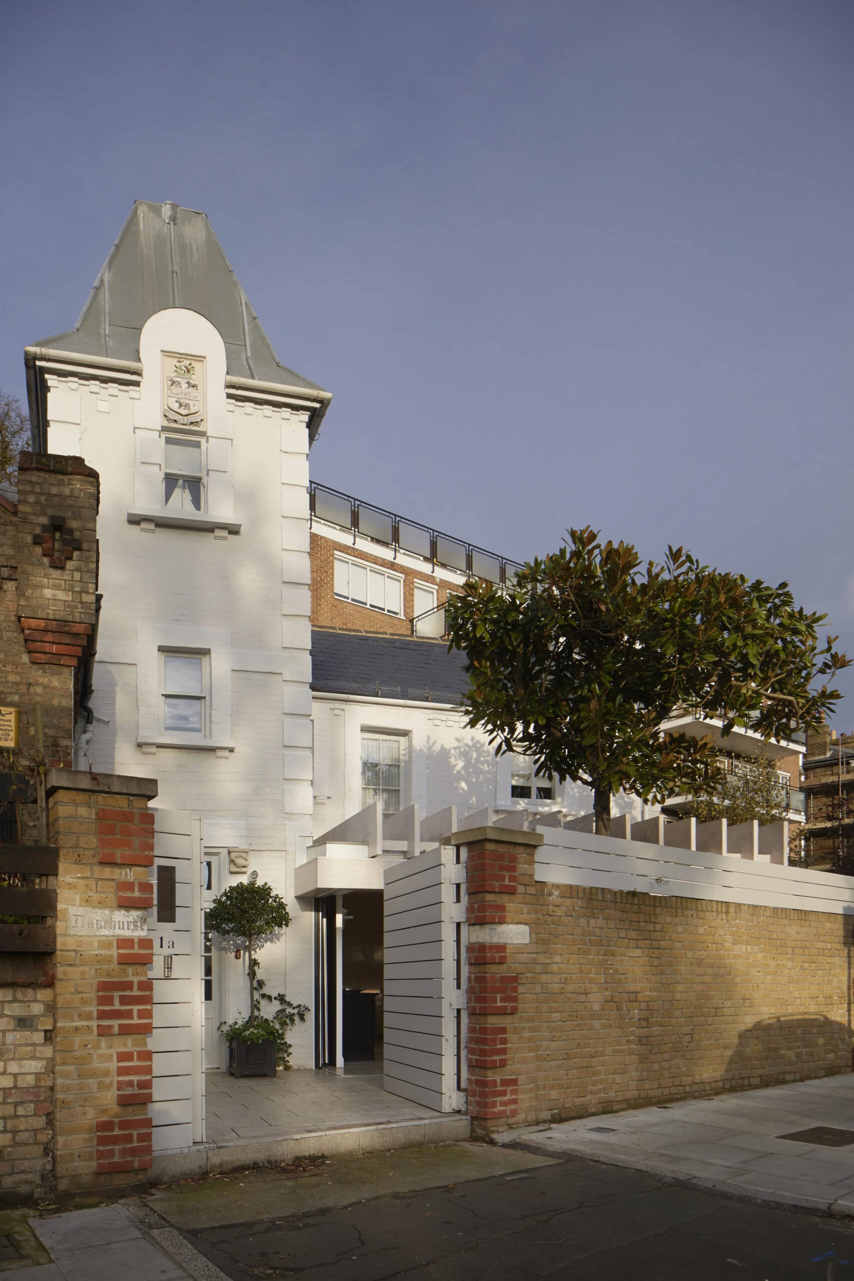 Tower and cottage in their street setting.