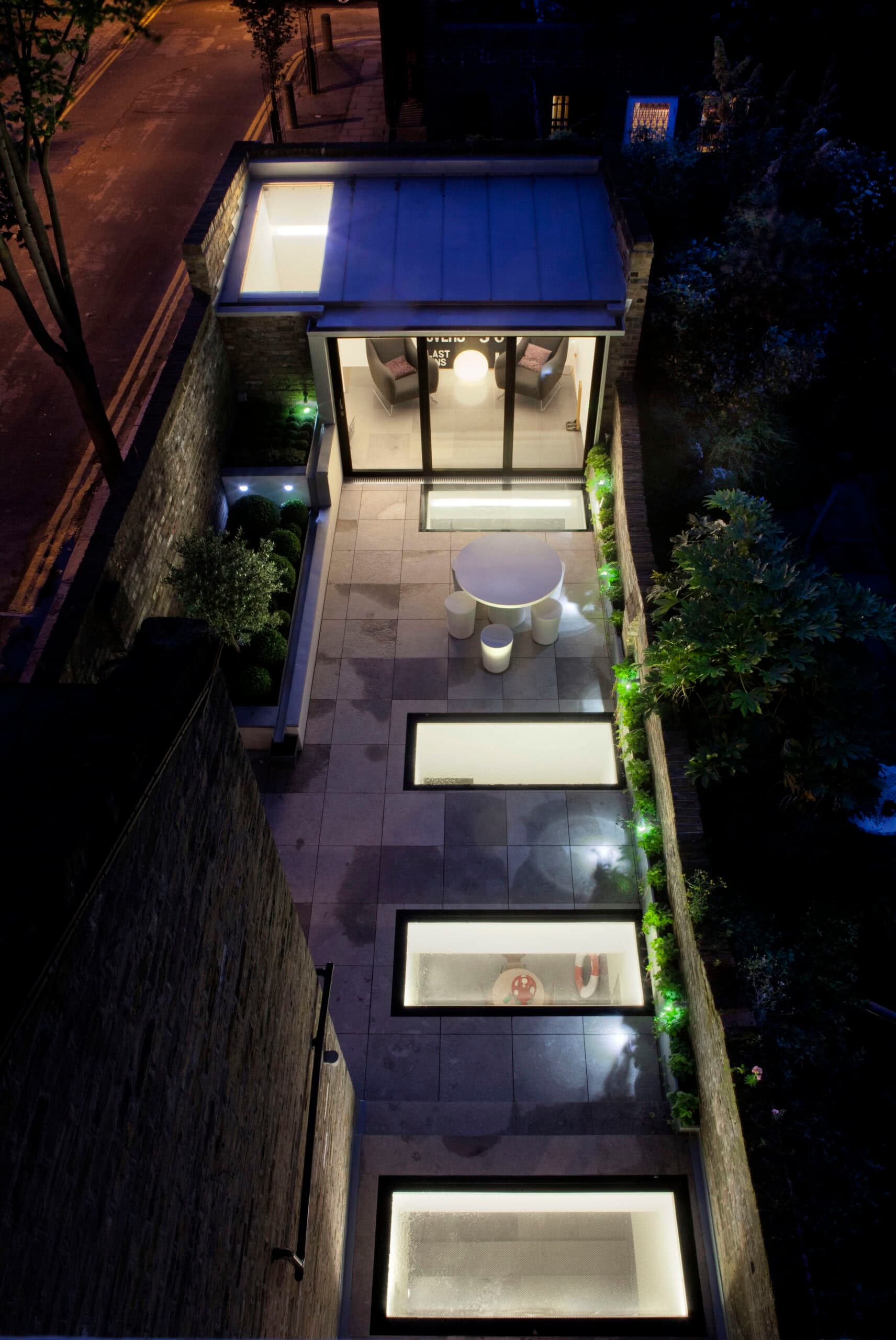 Night view from above of the garden and rooflights.