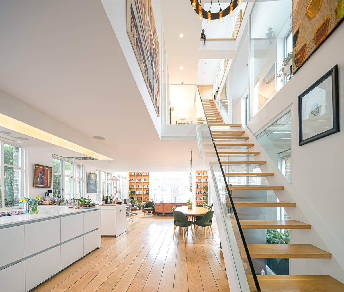 Bright, modern open-concept home interior with sleek design and inviting spaces for living.