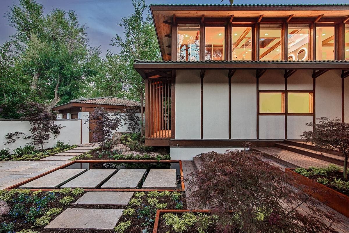 Stylish contemporary home blending modern architecture with nature-inspired elements and vibrant landscaping.