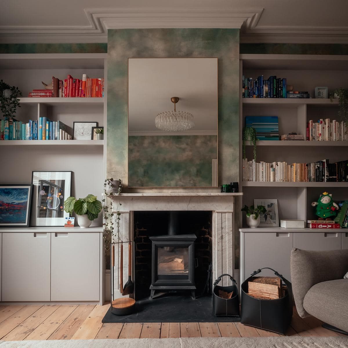 Inviting living room blending modern and traditional styles with a stone fireplace and elegant decor.