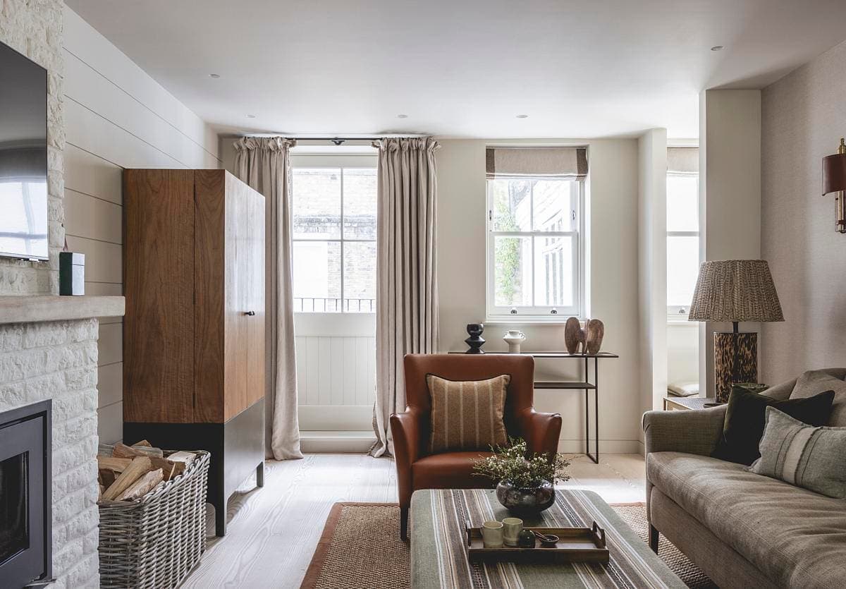 Inviting modern living room with stylish decor, natural light, and warm colour accents.