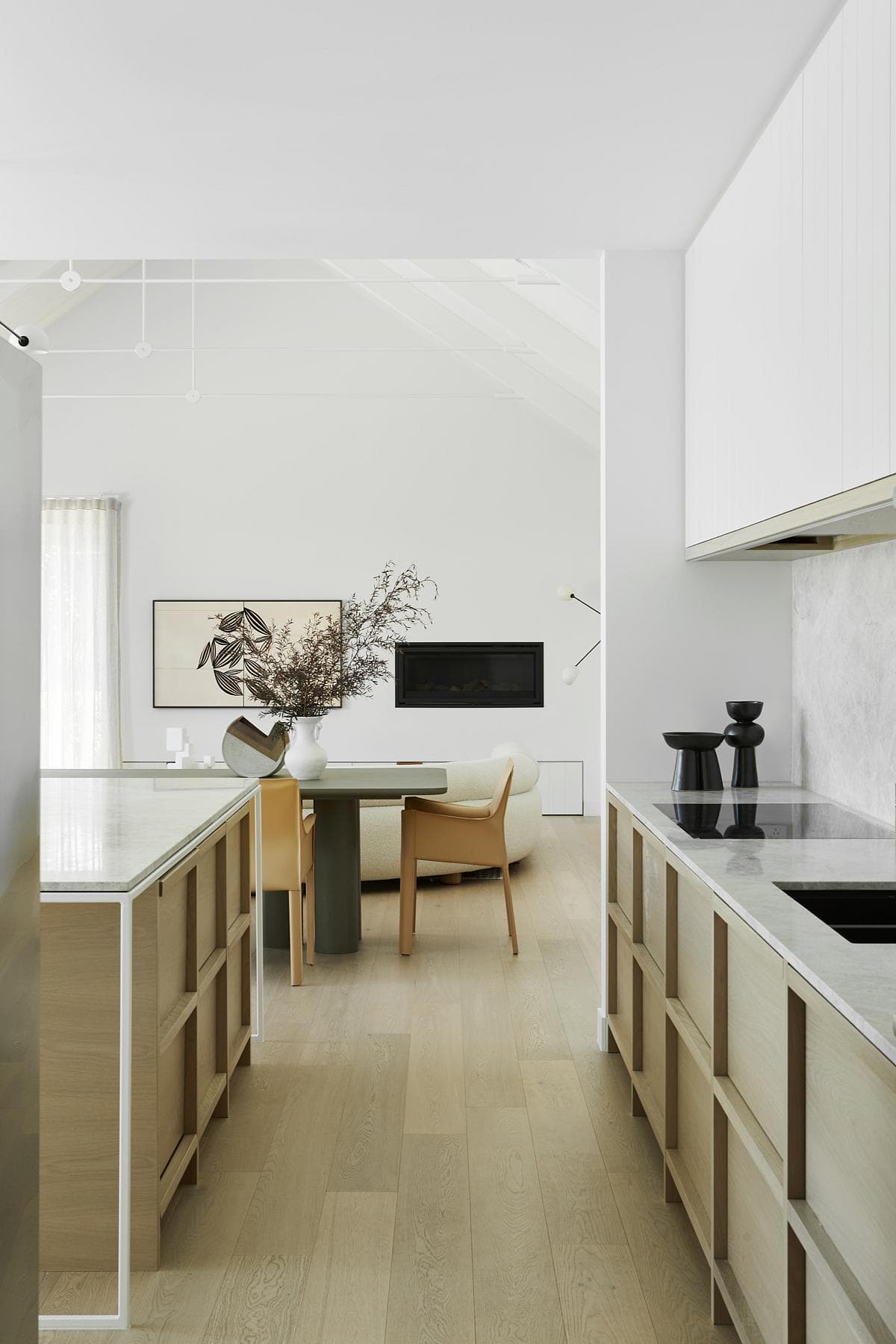 Contemporary kitchen and dining space with elegant design and natural light.