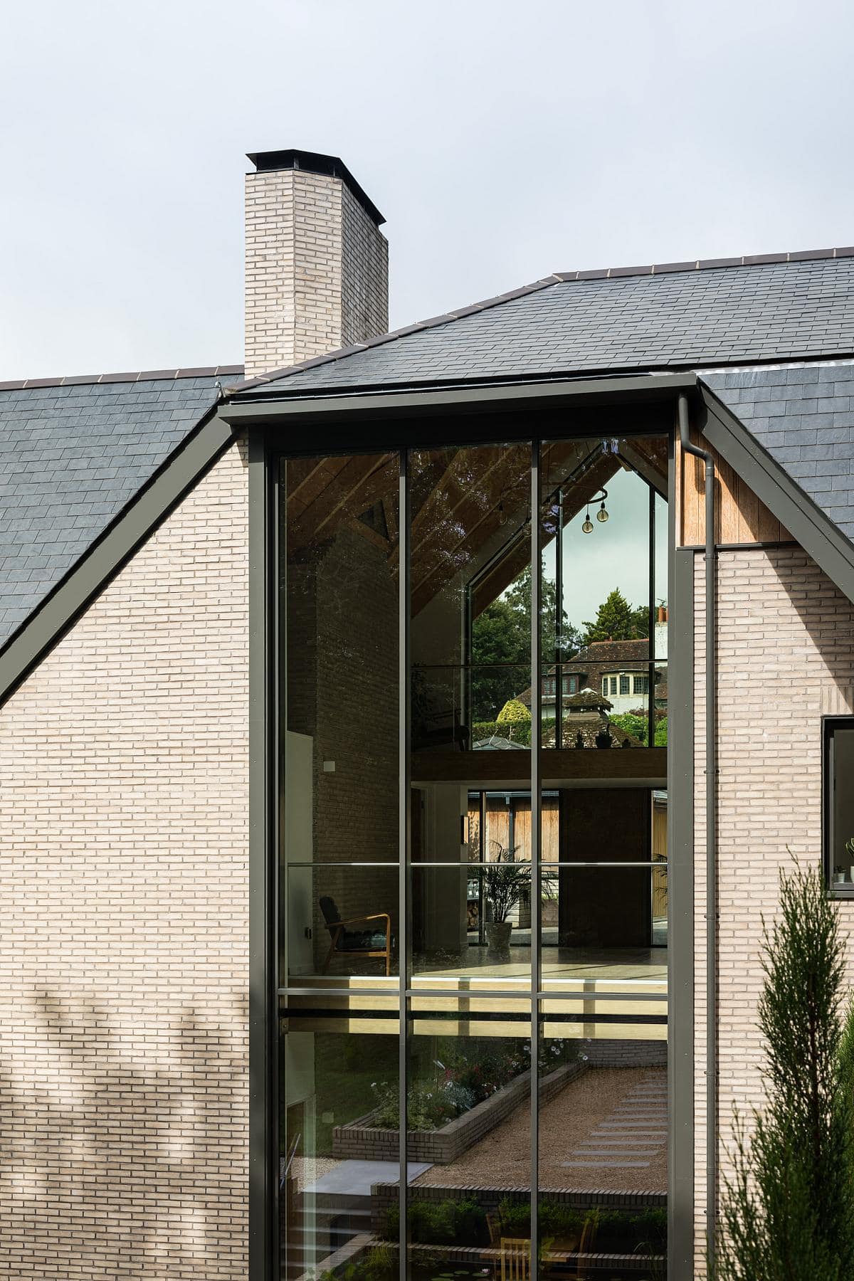 Modern architectural design blending brick and glass for a harmonious living space at Highoaks.