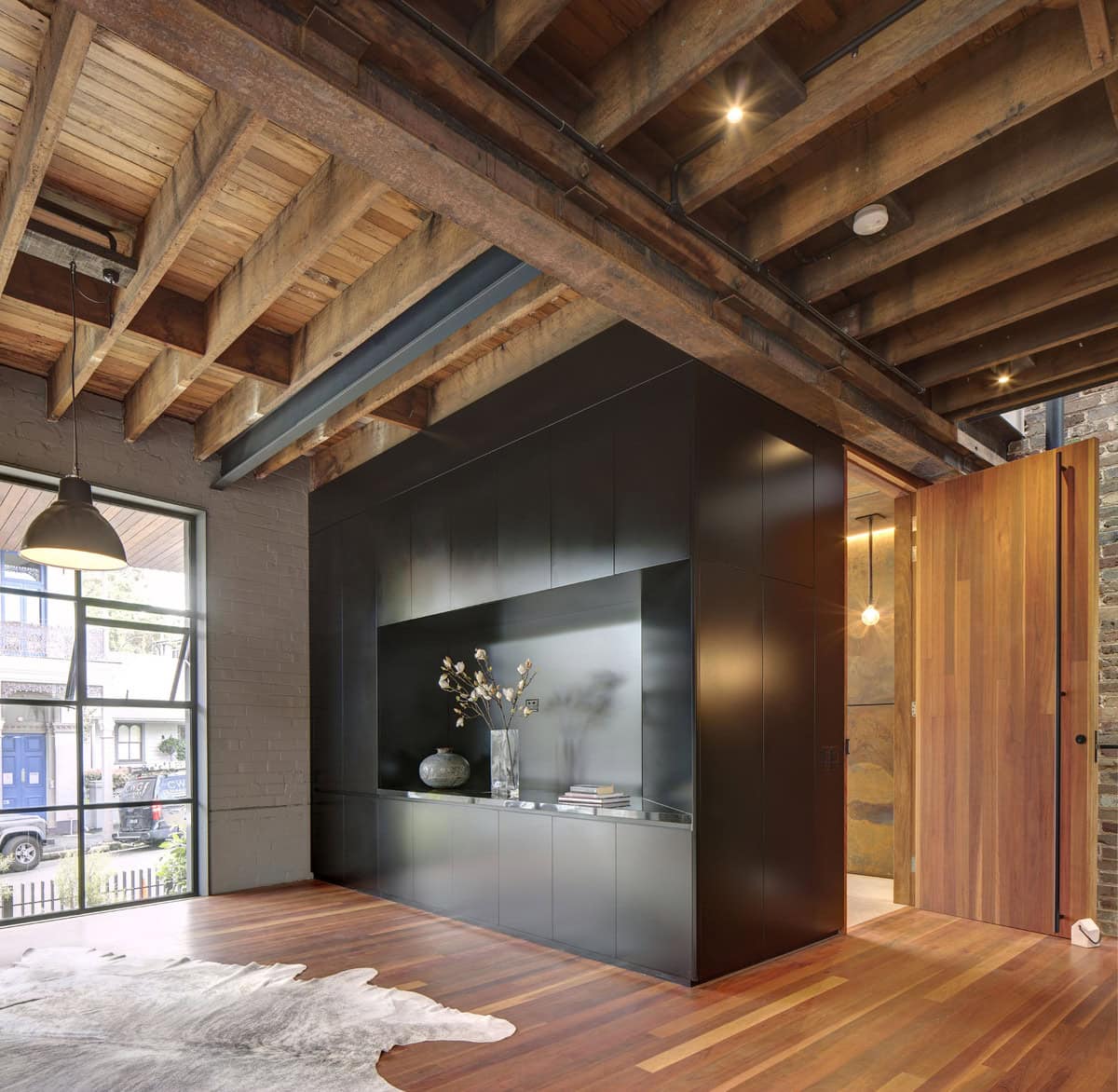 Elegant contemporary rustic living room blending modern design with warm natural elements.