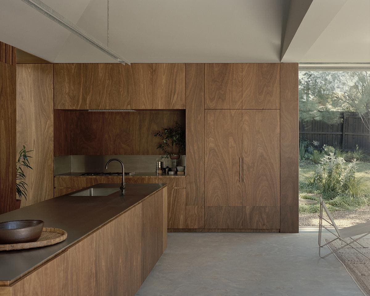 Contemporary kitchen featuring warm wood accents and abundant natural light for a serene environment.