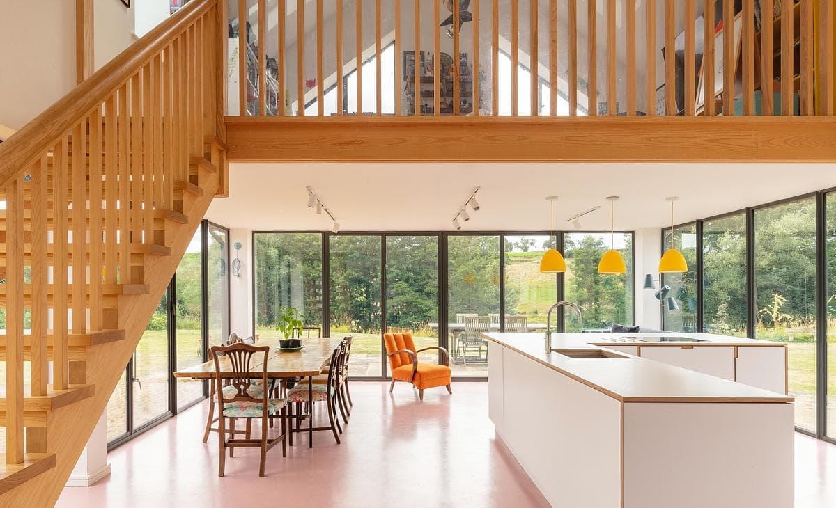 Modern open-concept living space with natural light, stylish decor, and vibrant accents.