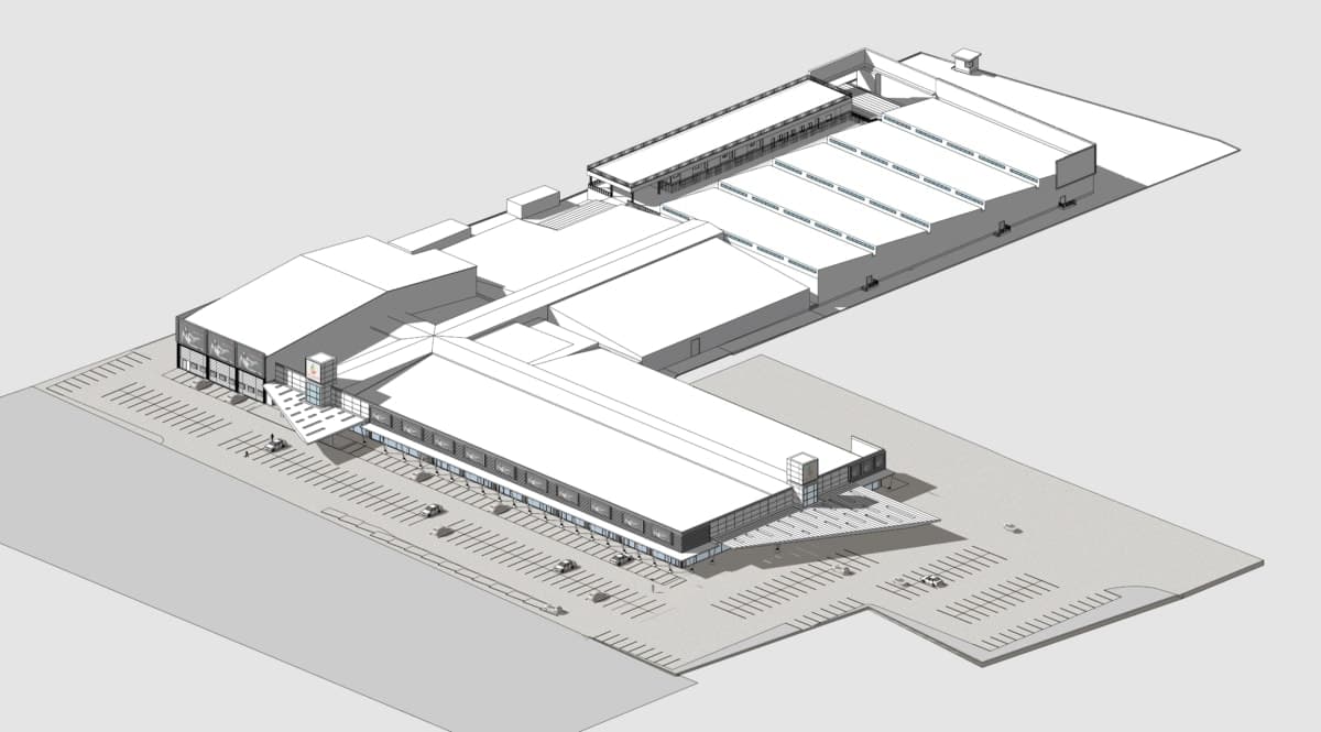 Diagram: modern industrial-style shopping mall with large glass entrance, flat roofs, skylights, and ample parking.