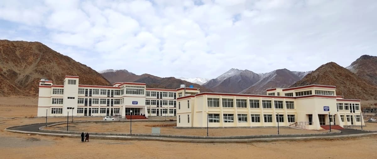 Leh Satellite Campus of Kashmir University against a mountainous backdrop.
