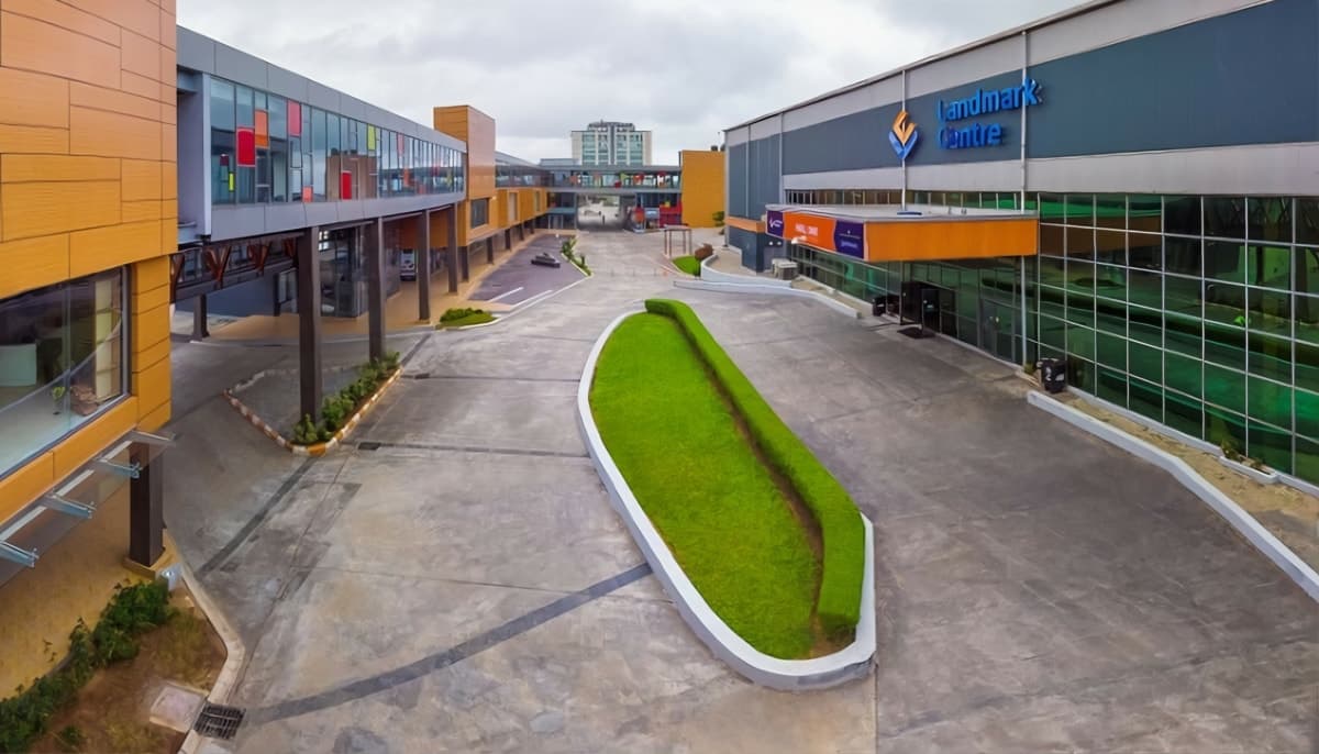 Retail complex surrounding a landscaped pedestrian courtyard.