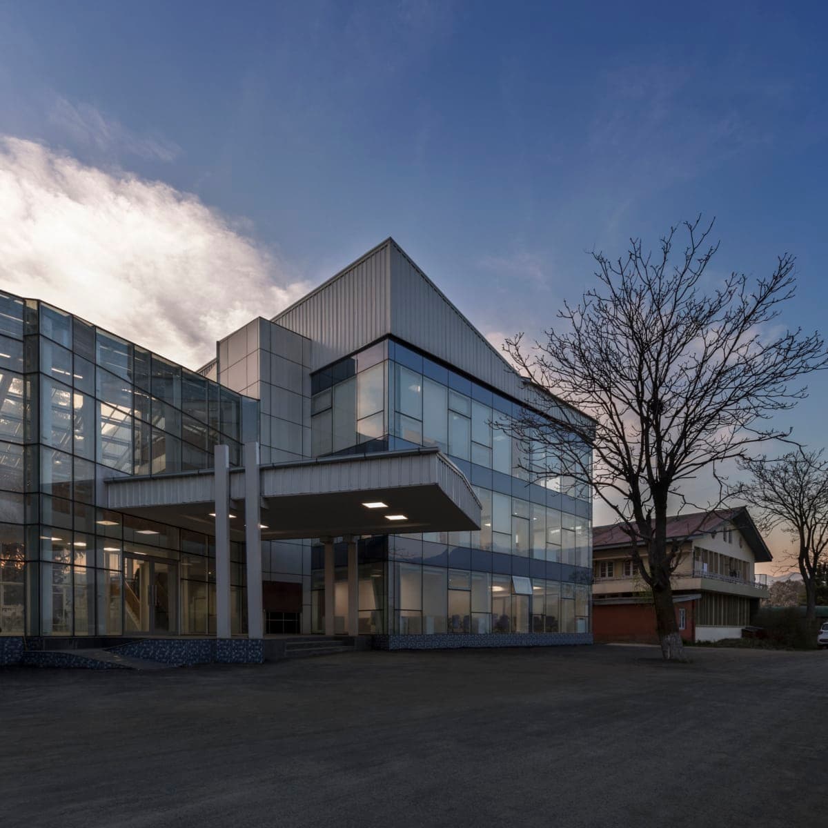 Modern glass administration building at Kashmir University, main campus.