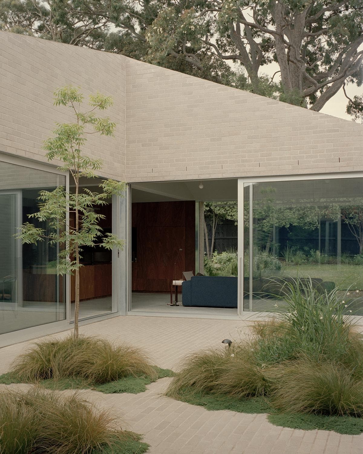 Contemporary architecture blending indoor comfort with natural beauty in serene outdoor settings.