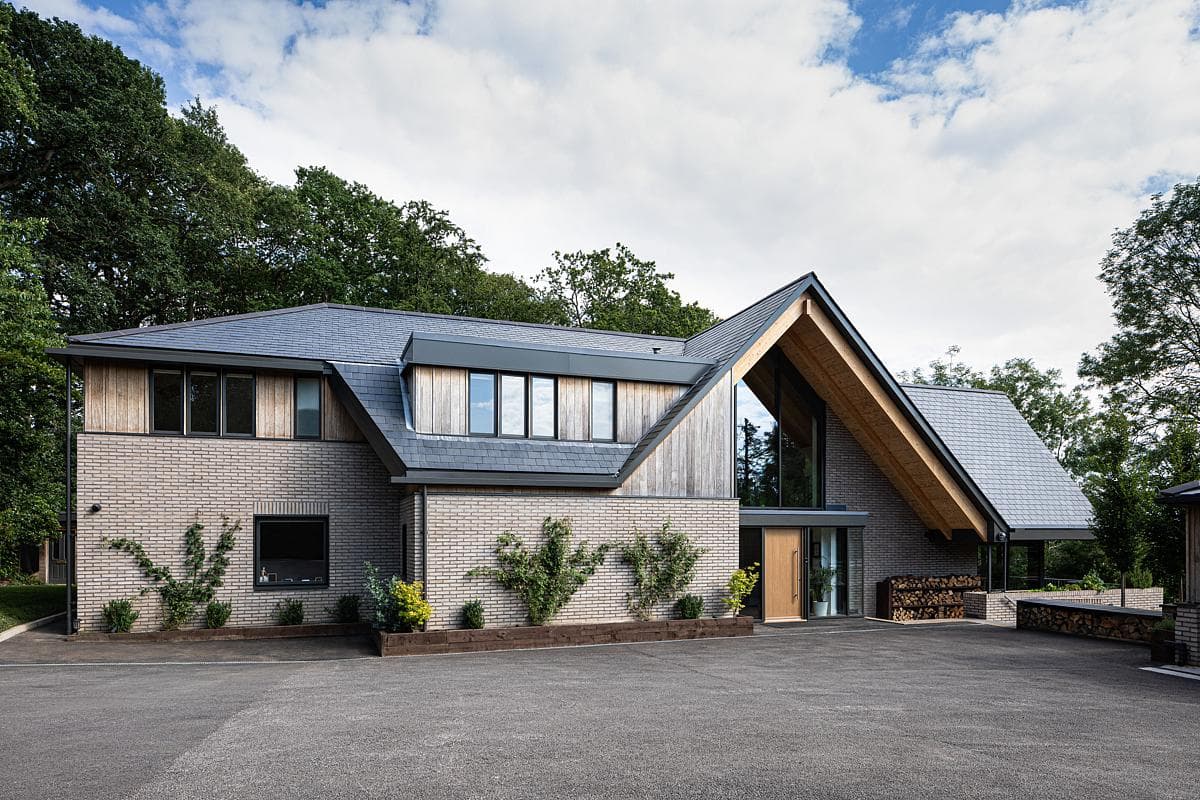 Contemporary home design blending natural elements with modern architecture in a serene setting.