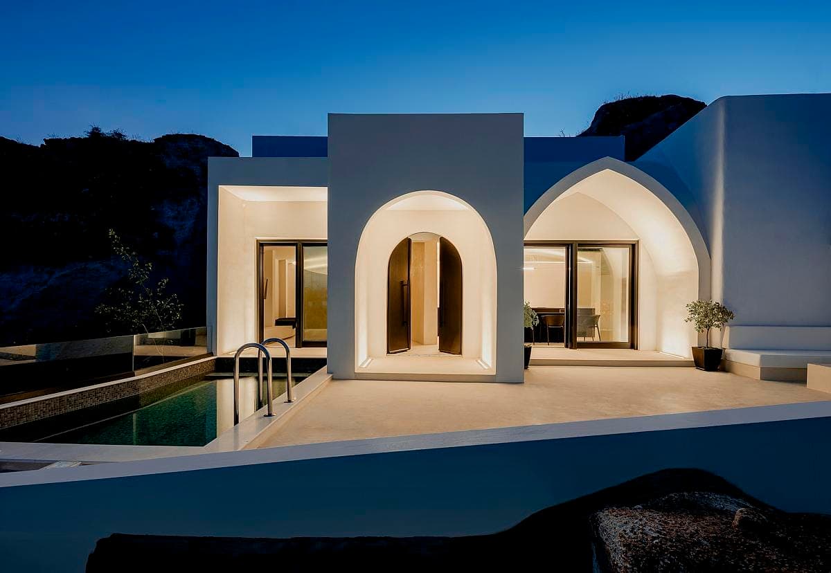 Contemporary architectural retreat blending minimalist design with natural surroundings at twilight.