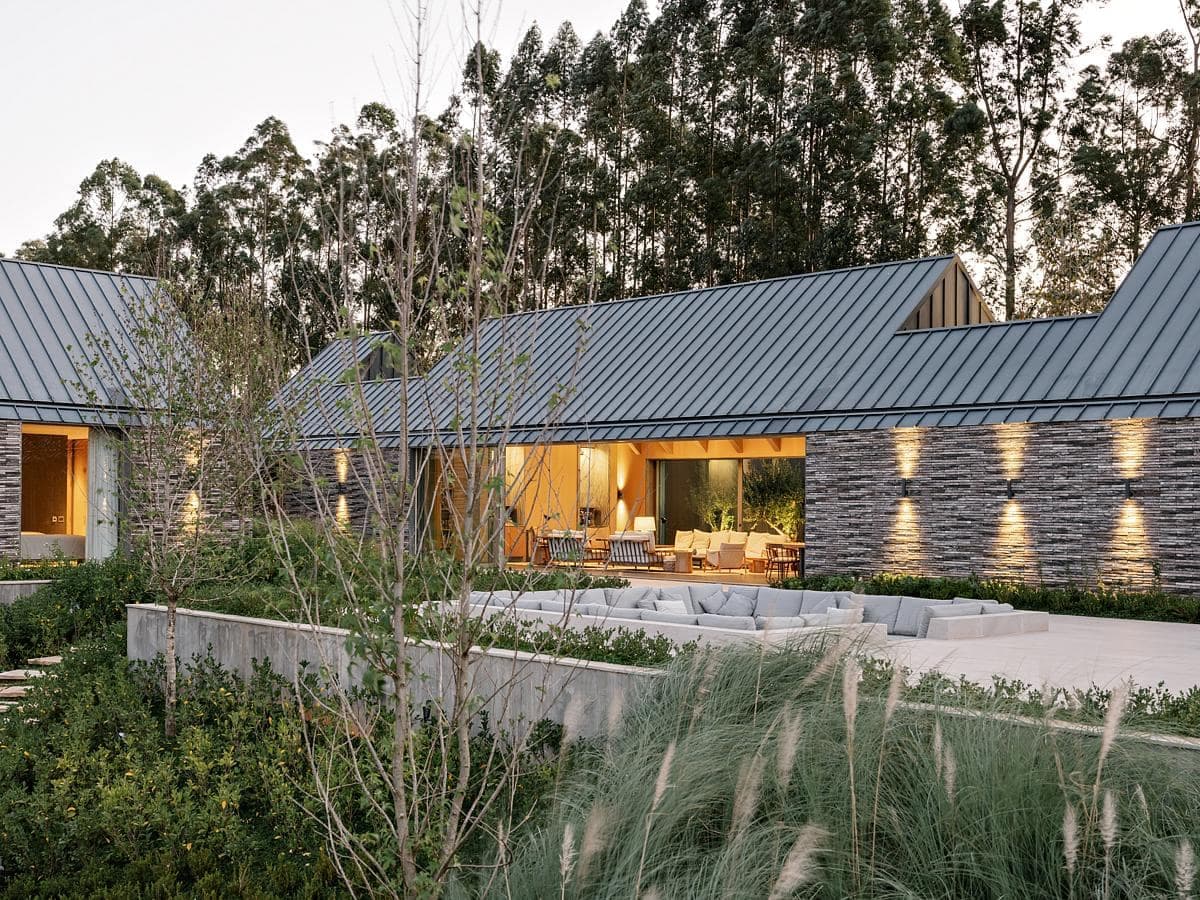 Modern architectural design seamlessly blending sleek materials with natures beauty for a tranquil retreat.