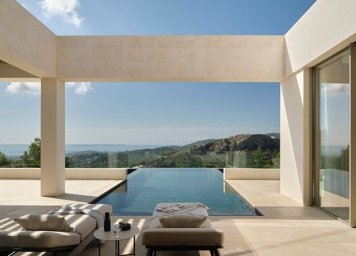 Stylish modern retreat featuring an infinity pool and breathtaking panoramic views of nature.