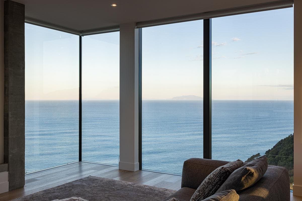 Stylish coastal living room with breathtaking ocean views and natural light.