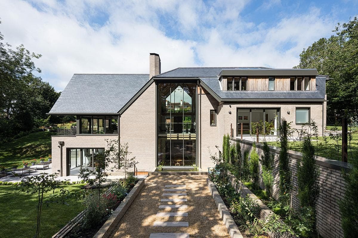 Sophisticated modern home seamlessly blending with lush garden and elegant architectural design.