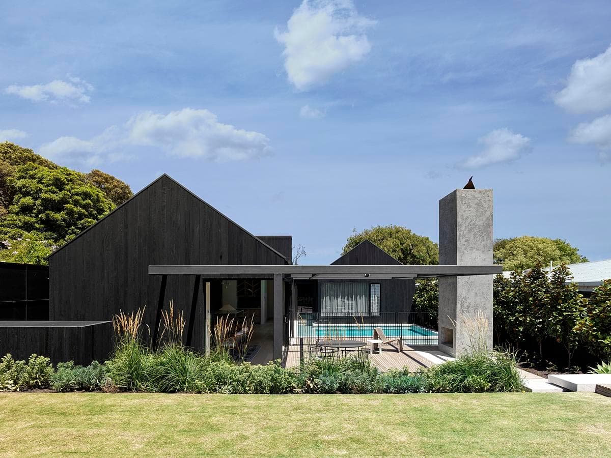 Sophisticated contemporary home design surrounded by lush greenery and modern outdoor amenities.