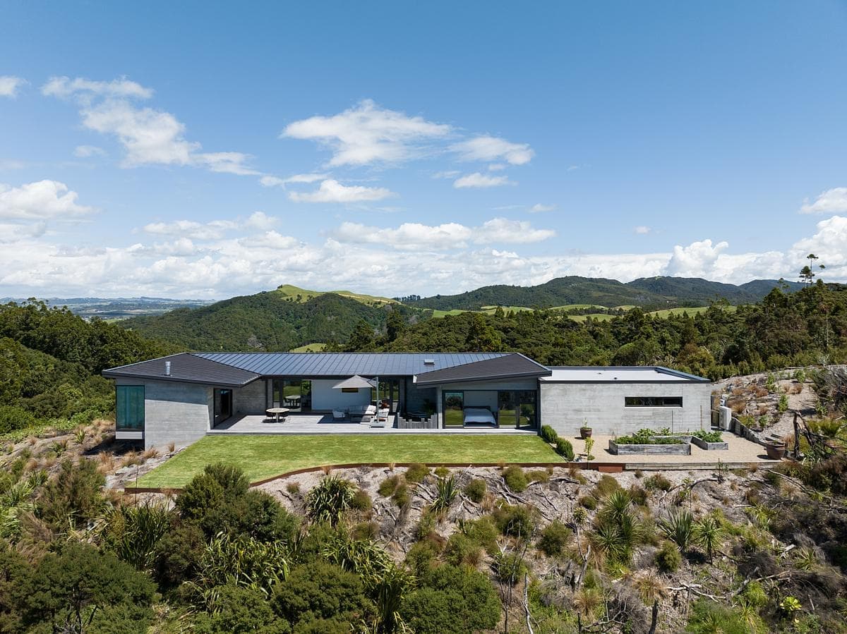 Contemporary home amidst tranquil hills, blending modern design with stunning natural scenery.