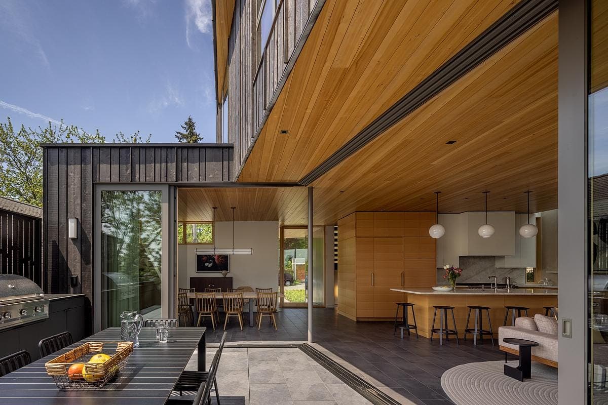 Modern home blending indoor and outdoor spaces, featuring elegant design and inviting natural light.