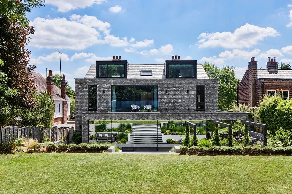 Modern architectural home with elegant garden design and seamless indoor-outdoor connection.