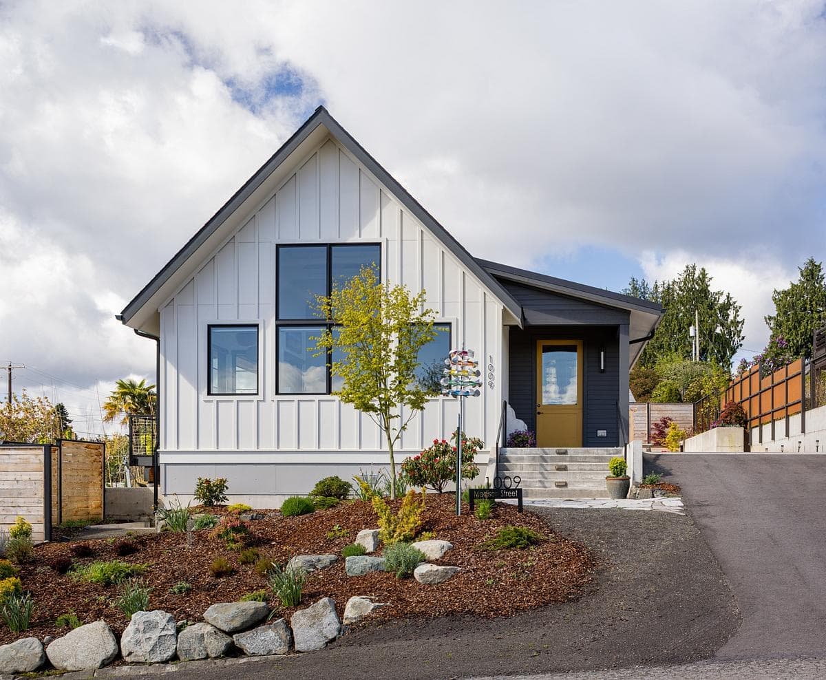 Contemporary single-storey home with stylish landscaping and inviting entrance, offering serene living environment.