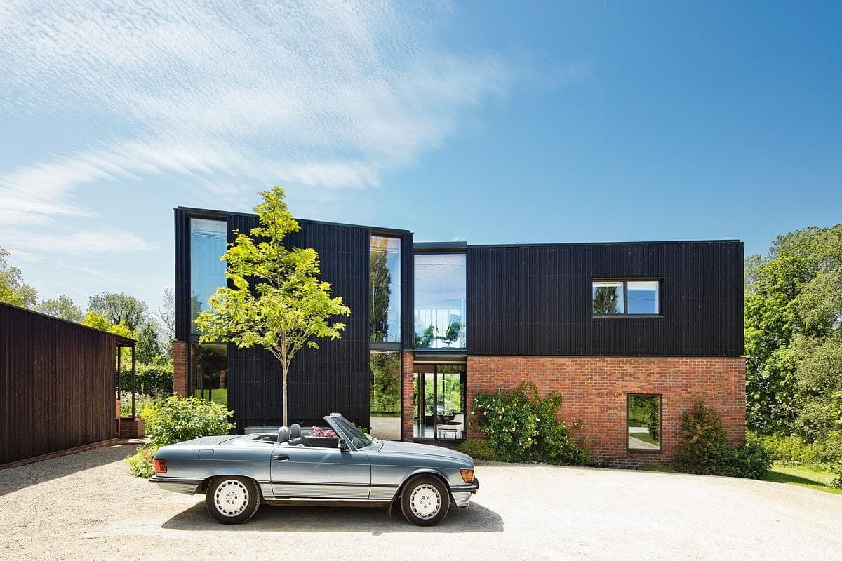 Contemporary house design harmonising modern architecture with natural surroundings and serene landscaping.