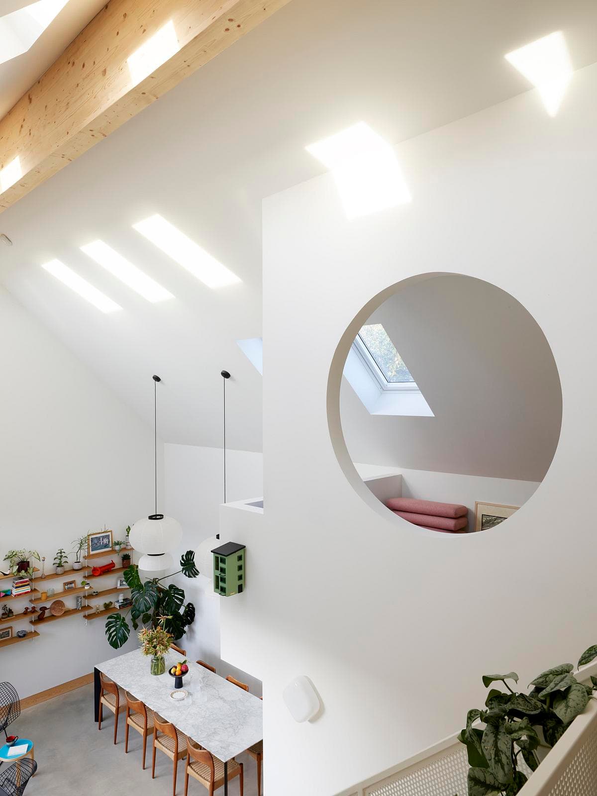 Bright modern interior with wood beams, natural light, and a harmonious design.