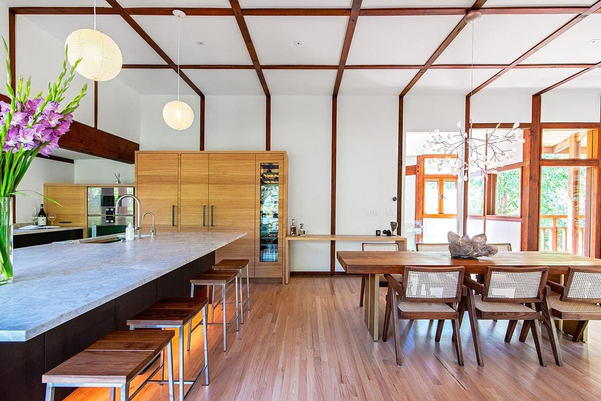 Modern kitchen and dining area featuring natural elegance, warm tones, and inviting design.