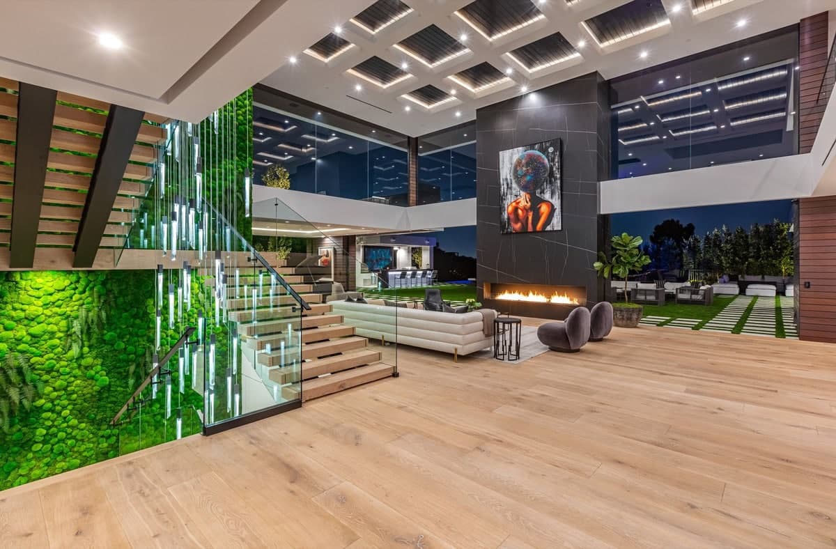 Stunning modern living area with vertical garden, sleek furnishings, and abundant natural light.