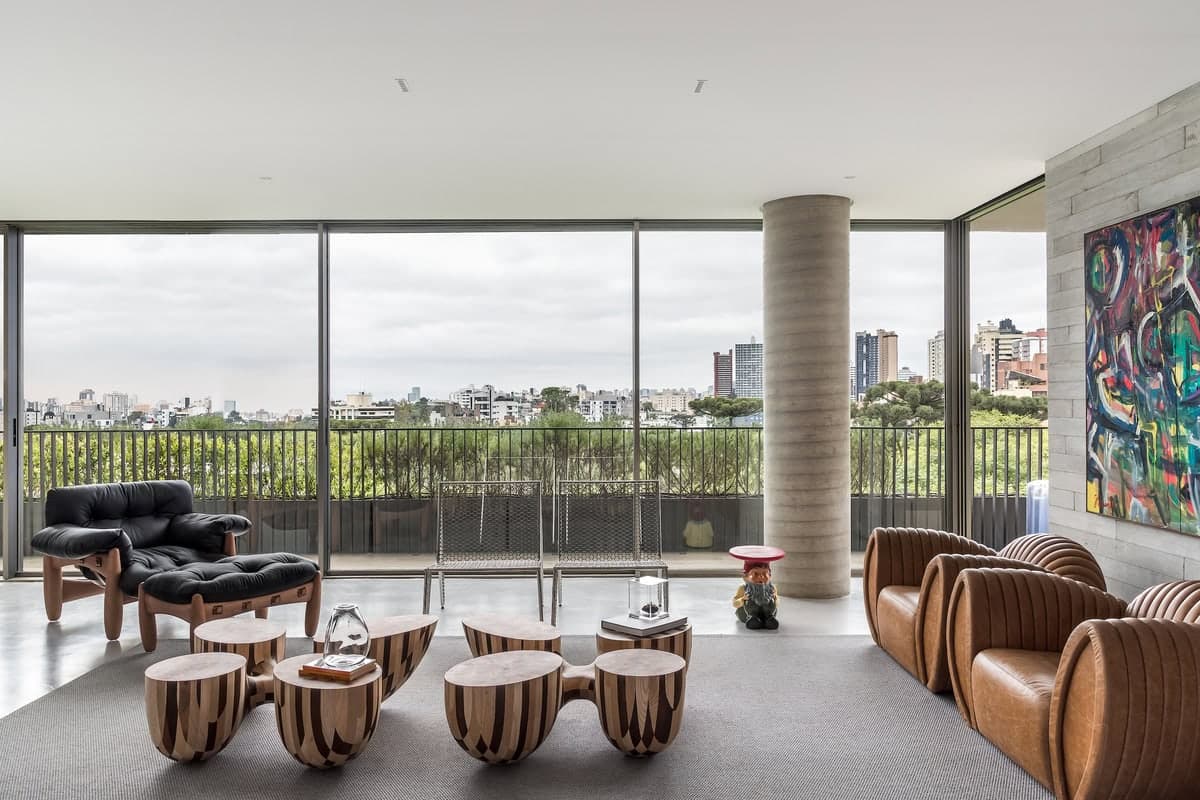 Elegant modern living space with city views, natural light, and stylish furnishings.