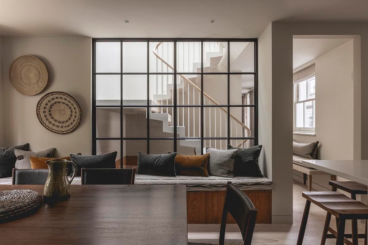 Contemporary living space featuring a wooden dining table and stylish, inviting decor.