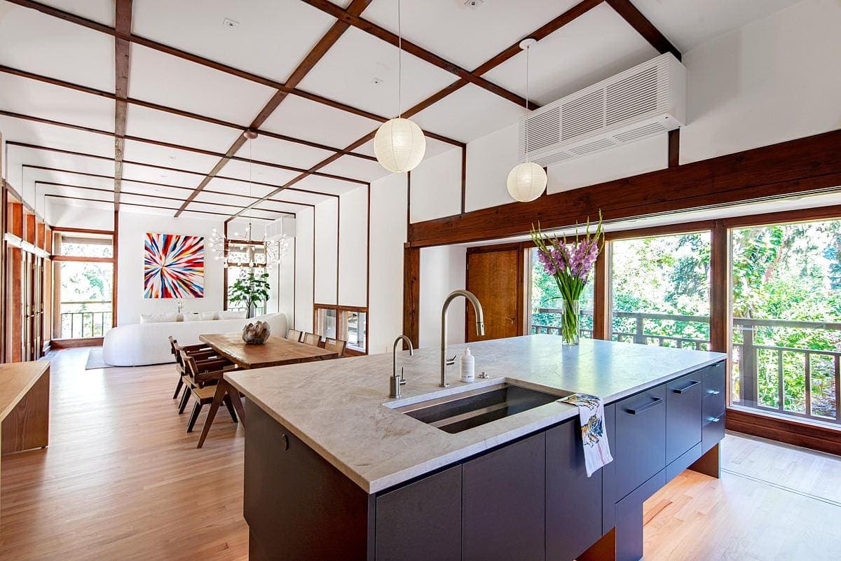 Chic modern kitchen with minimalist design, bright spaces, and natural accents.