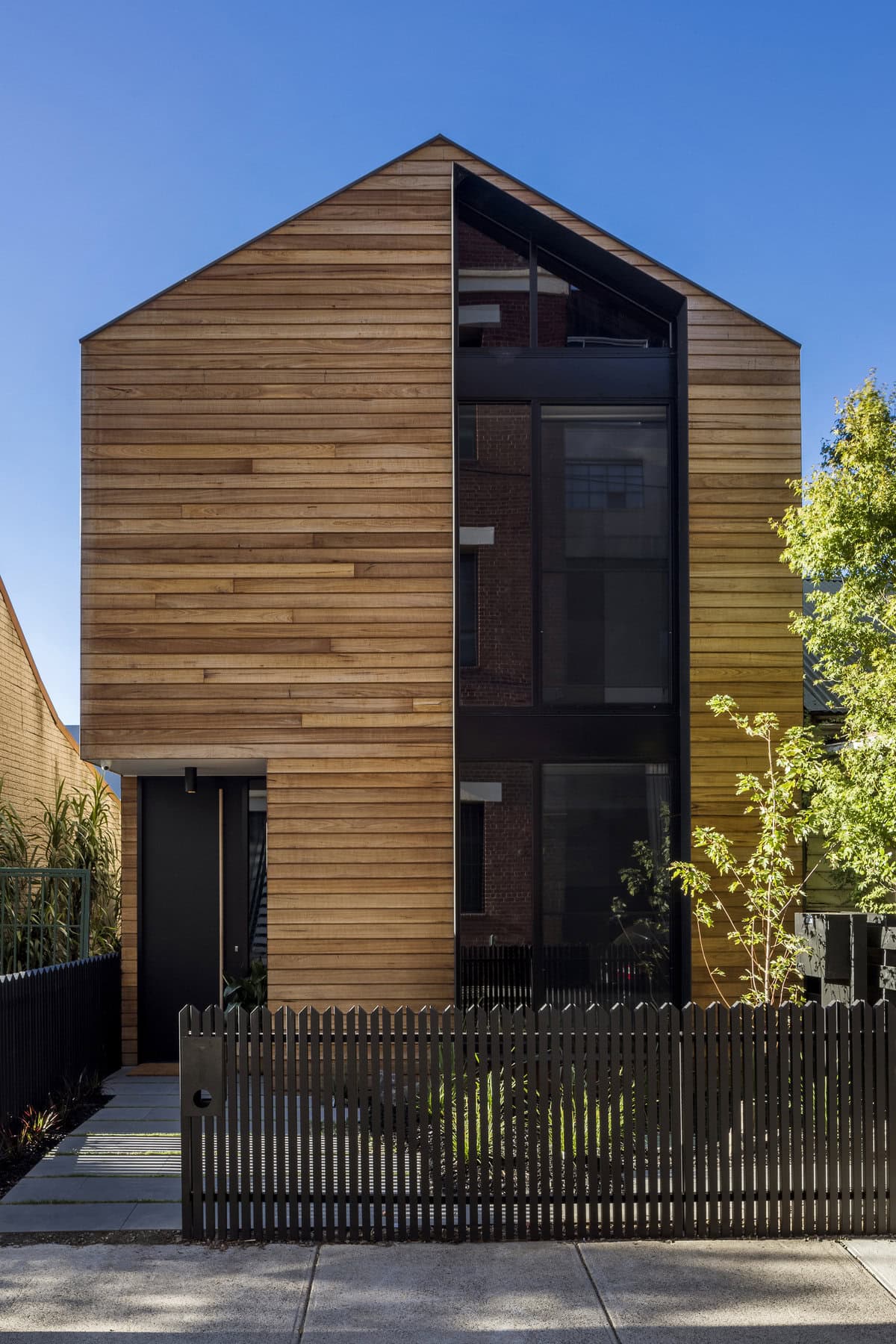 Modern wooden-clad residence showcasing sleek design and natural aesthetics by FYC Architects.